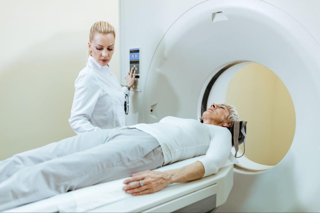 senior woman undergoing MRI scan